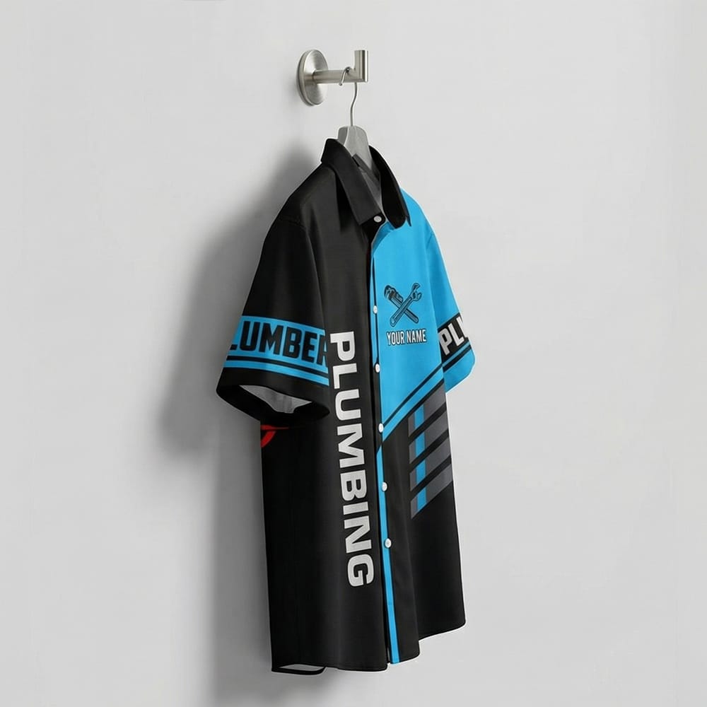 Dripping Faucet Logo Plumbing Hawaiian Shirt with Custom Name & Number Detail of the black and blue dripping faucet plumber shirt, featuring crossed pipe wrenches and PLUMBER text on the sleeves.