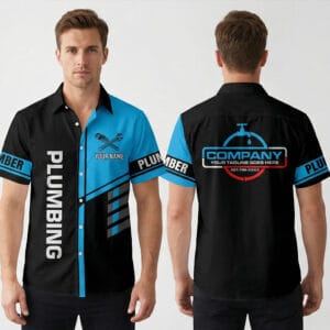 Front view of a black and blue dripping faucet plumber shirt. Features vertical PLUMBING text and custom name with wrenches.