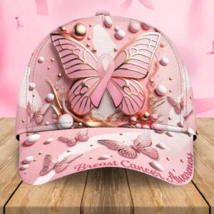 Front view of a pink breast cancer butterfly cap featuring a large 3D ribbon butterfly and awareness text on the brim.