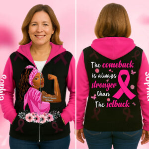 Front view of black and pink breast cancer warrior hoodie with a flexing woman graphic, floral details, and zip closure.
