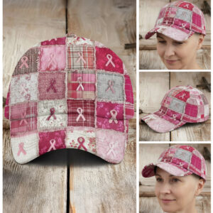 Front view of the pink ribbon patchwork cap on wood, featuring frayed squares in pink, grey, and white plaid and floral.