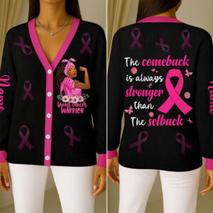 Front view of black breast cancer warrior cardigan featuring pink trim, ribbons, and a strong woman graphic.