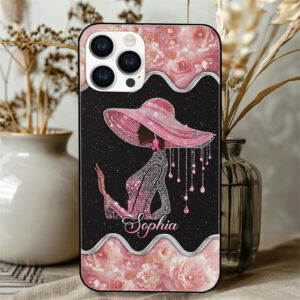 Back view of a black and pink rhinestone silhouette phone case with floral borders, custom name, and awareness ribbon.