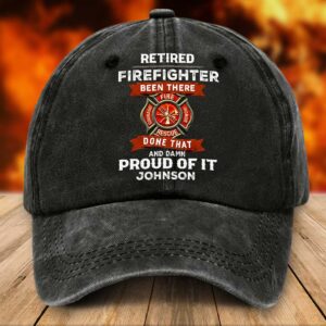 Front view of a custom firefighter cap in black, featuring bold text and a firefighter emblem.