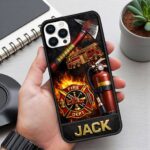 Close-up view of the firefighter phone case featuring vibrant red and black design with personalized name 'JACK'.
