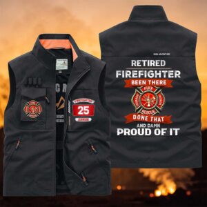 Front view of a custom firefighter vest in black with vibrant patches and pockets for tools.