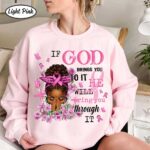 Front view of a light pink christian breast cancer sweatshirt featuring a praying woman, pink ribbons, and faith quote.