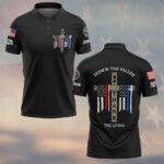 Front view of black honor the fallen polo featuring a wooden cross chest logo with red and blue line tattered flags.