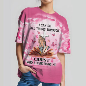 Front view of pink christ strengthens me shirt with praying hands, open bible, cross, and breast cancer ribbons.