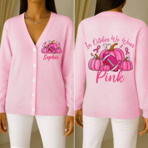 Front view of a custom breast cancer cardigan in pink with pumpkin and ribbon graphics.