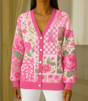Front view of the breast cancer cardigan in pink, featuring floral designs and a pink ribbon detail.