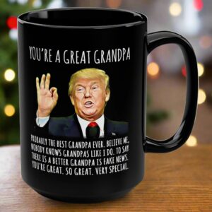 Front view of the black you're a great grandpa mug featuring humorous text and a caricature design.