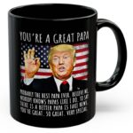 Front view of the black you're a great papa mug featuring a humorous Trump design and American flag background.