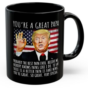 Front view of the black you're a great papa mug featuring a humorous Trump design and American flag background.