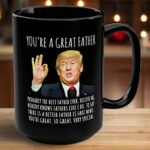 Front view of the you're a great father mug in black, showcasing humorous design with text and image.