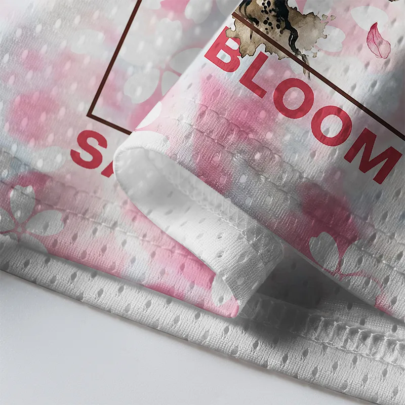 Sakura Bloom Mesh Jersey Close-up detail of the sakura bloom mesh jersey highlighting the intricate floral print and breathable mesh fabric.