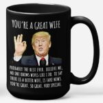 Front view of the black 15oz you're a great wife mug with humorous Trump quote design.