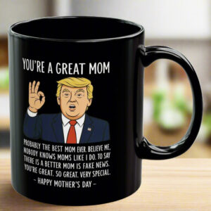 Black 11oz mug featuring 'You're A Great Mom' design with cartoon Trump, front view on wooden table