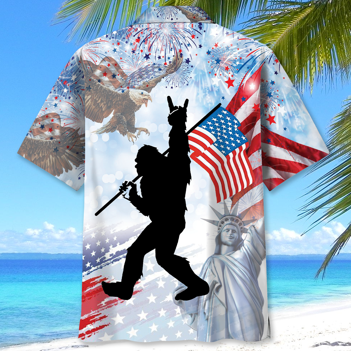 Bigfoot USA Hawaiian Shirt Lifestyle shot of a person wearing the Bigfoot USA Hawaiian shirt at a beach, embodying summer vibes and patriotism.
