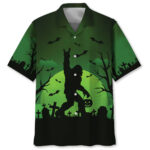 Front view of the bigfoot halloween night green hawaiian shirt featuring a spooky design with bats and tombstones.