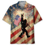 Front view of the patriotic Bigfoot waving USA flag Hawaiian shirt with festive fireworks background.