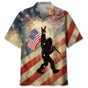 Front view of the patriotic Bigfoot waving USA flag Hawaiian shirt with festive fireworks background.