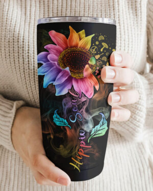 Colorful hippie soul sunflower tumbler held in a hand, showcasing vibrant flower design and smoky accents.