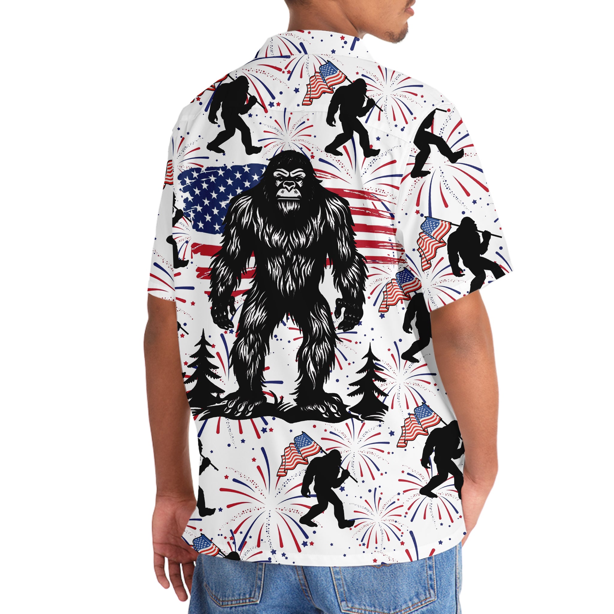 Bigfoot Independence Day Fireworks Hawaiian Shirt Flat lay of the Bigfoot Independence Day fireworks Hawaiian shirt with patriotic decorations emphasizing its fun theme.