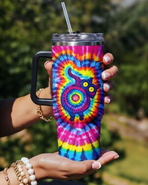 Colorful swirl pattern tumbler with a vibrant cat design, showcased from the front in a sunny outdoor setting.