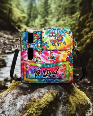 Front view of the I'm The Tie Dyed One tumbler storage bag with vibrant floral patterns.