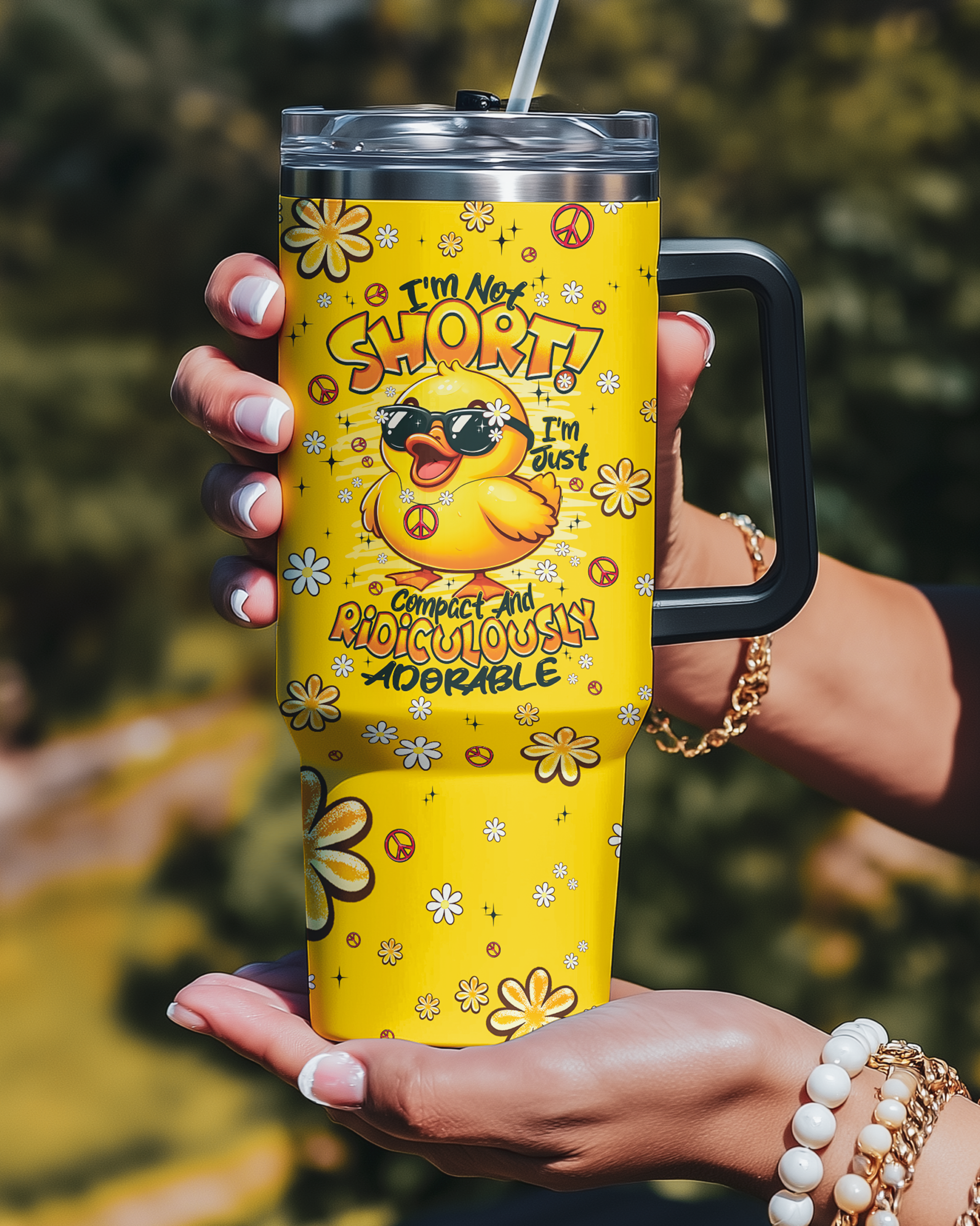 im not short duck hippie tumbler Bright yellow I'M NOT SHORT DUCK HIPPIE TUMBLER held up, featuring a cute duck with sunglasses and floral designs.