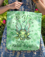Front view of the BE YOU THE WORLD WILL ADJUST TOTE BAG with a vibrant frog design and green color.