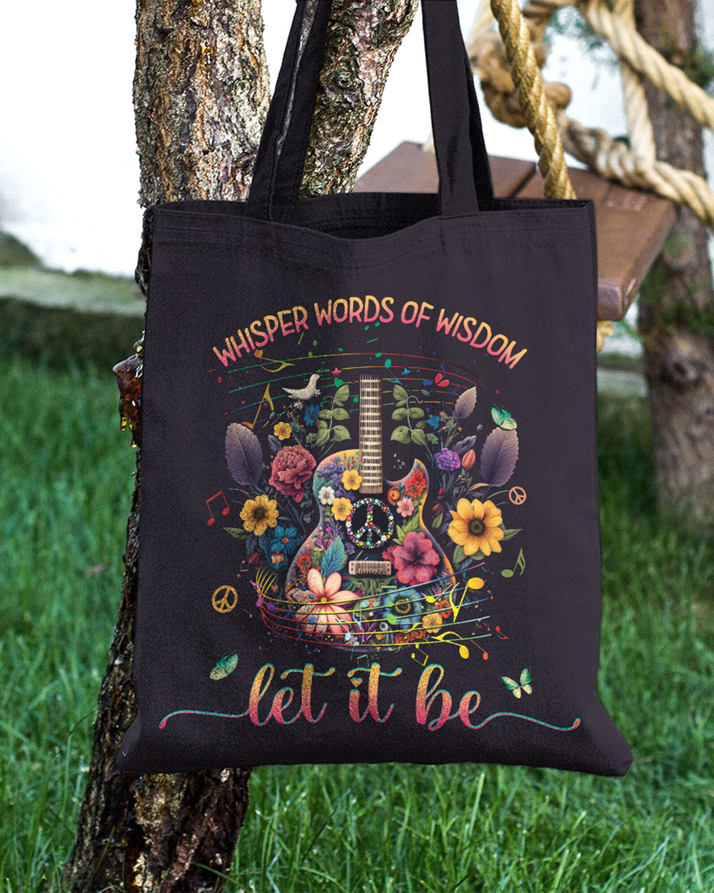 Let It Be Guitar Tote Bag Detail shot of the let it be guitar tote bag with intricate floral patterns and colorful musical notes accenting the guitar.