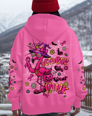 Back view of pink flamingo Halloween apparel featuring vibrant graphics and cozy hoodie design.