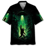 Front view of the Bigfoot night green Hawaiian shirt with a vibrant design of Bigfoot and UFOs against a dark background.