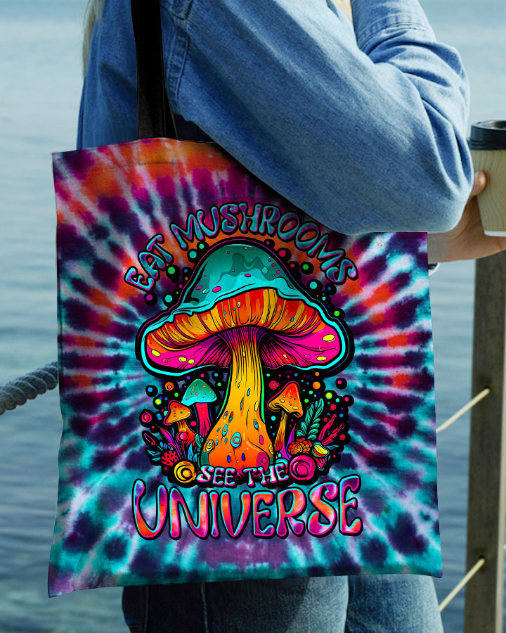 Eat Mushrooms See The Universe Tote Bag Back of the eat mushrooms see the universe tote bag showcasing the tie-dye pattern with sturdy black handles.