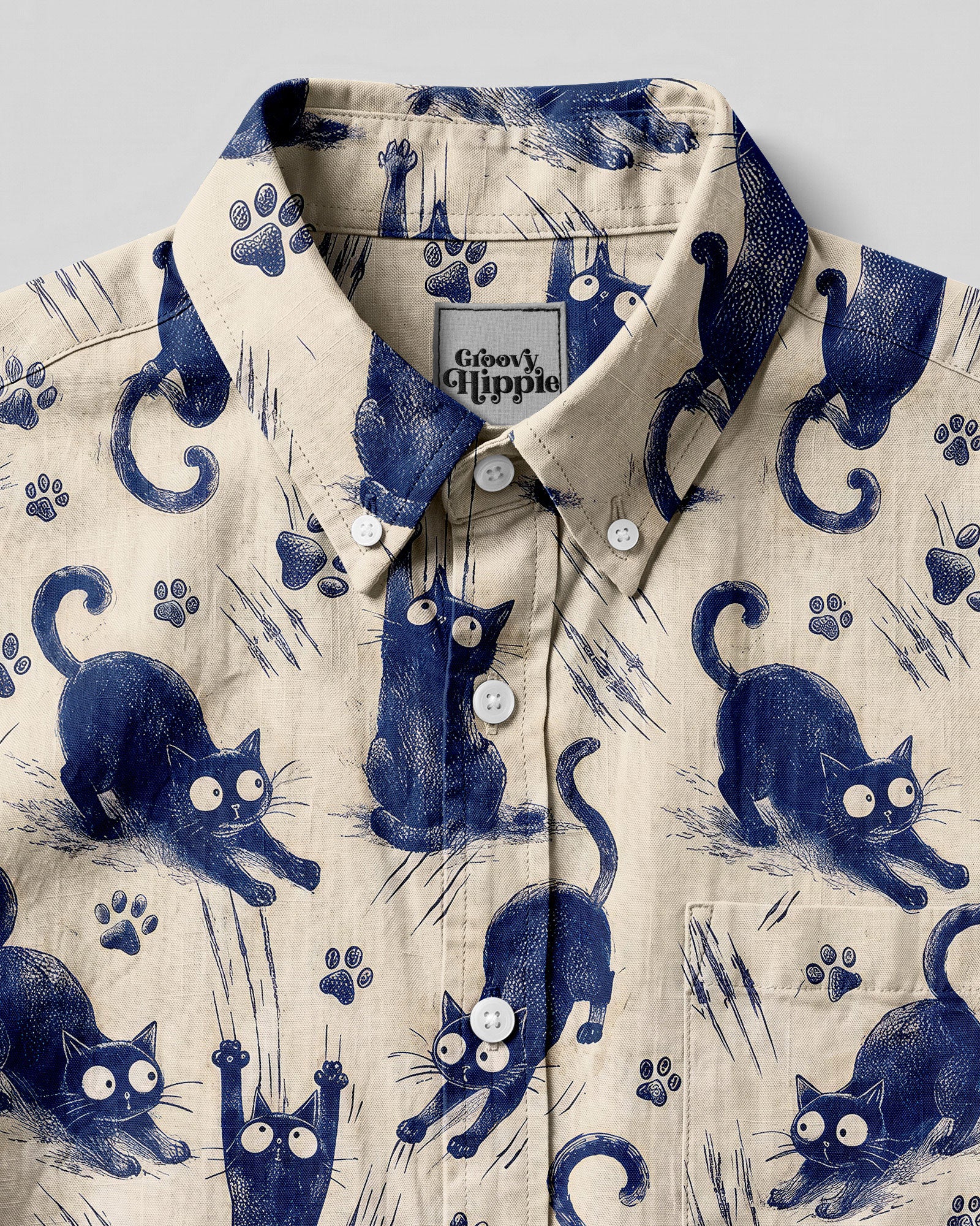 Funny Playful Cat Button-Down Collar Shirt Close-up of the funny playful cat button-down shirt highlighting the unique cat illustrations and fabric texture.