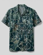 Front view of the elephant pattern camp shirt featuring a teal background with intricate elephant designs.