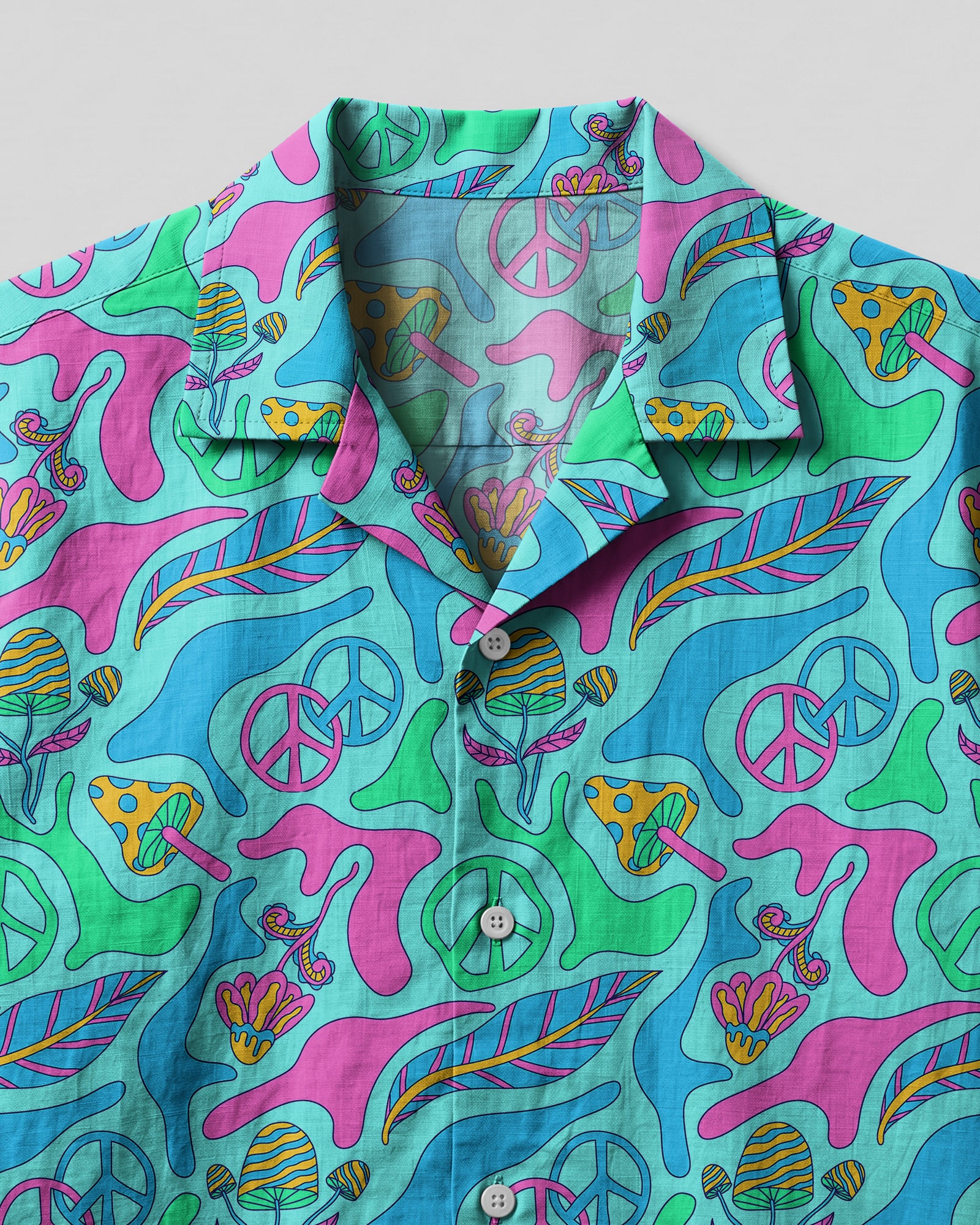 Hippie Ocean Breeze Camp Shirt Close-up detail of the hippie ocean breeze camp shirt's fabric, highlighting the intricate designs of sea life and flowers.