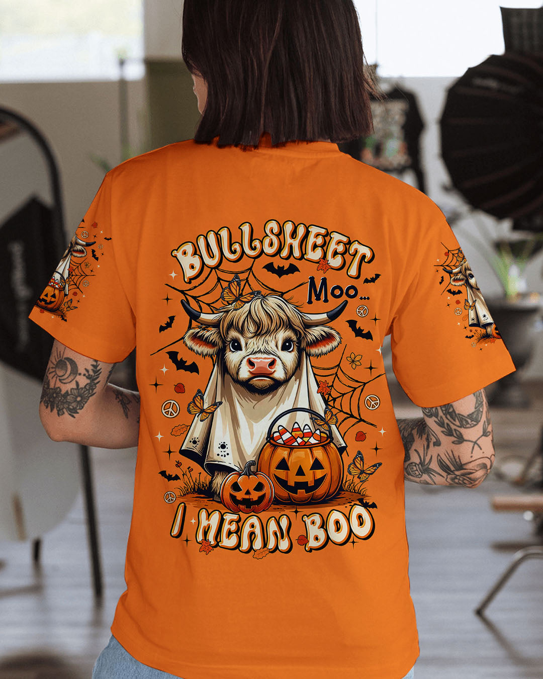 Bullsheet Moo I Mean Boo Shirt | Halloween Fun Front view of the Bullsheet Moo I Mean Boo shirt showcasing vibrant orange color and spooky graphics.