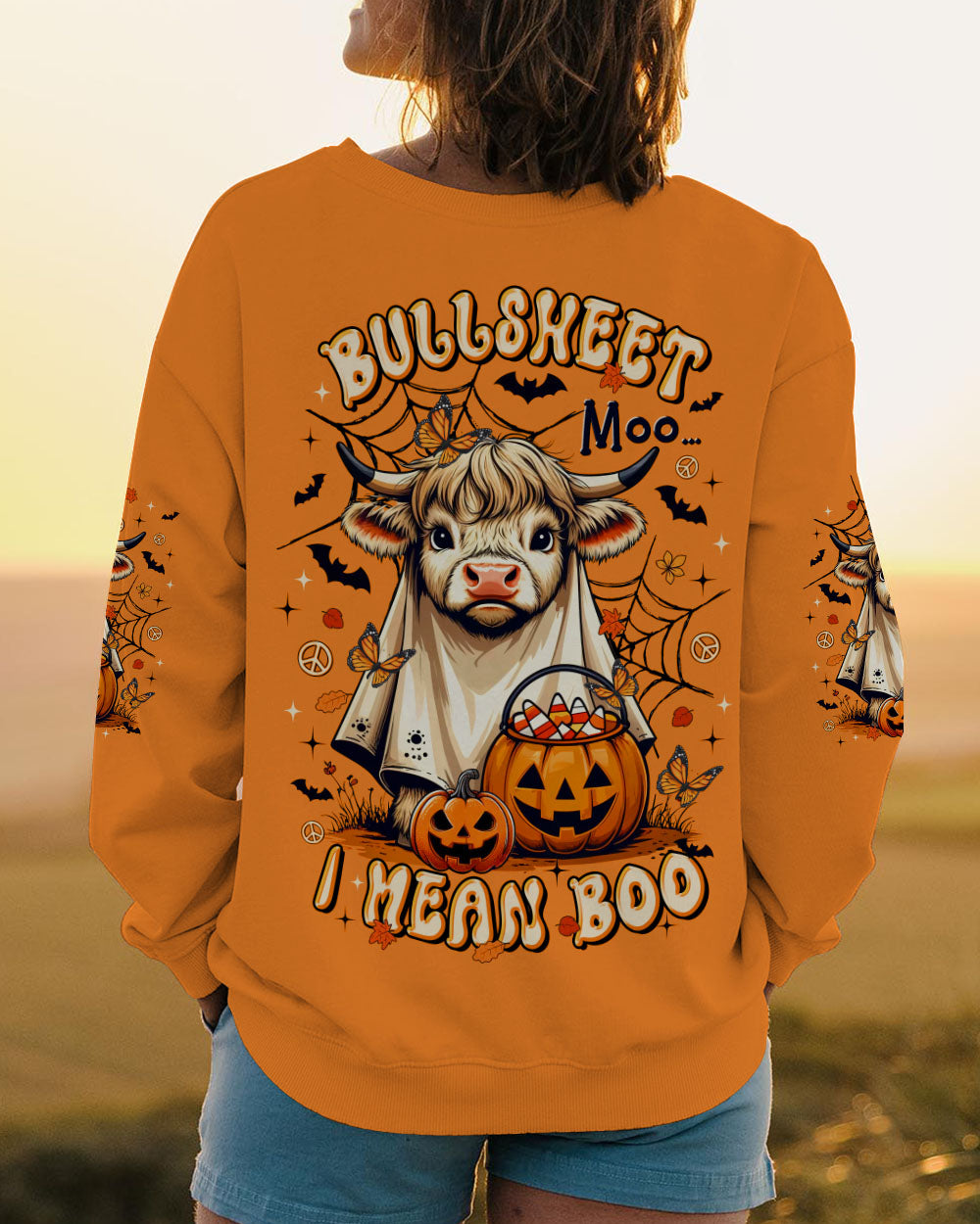Bullsheet Moo I Mean Boo Shirt | Halloween Fun Front view of the Bullsheet Moo I Mean Boo shirt with a spooky cow and festive autumn colors.