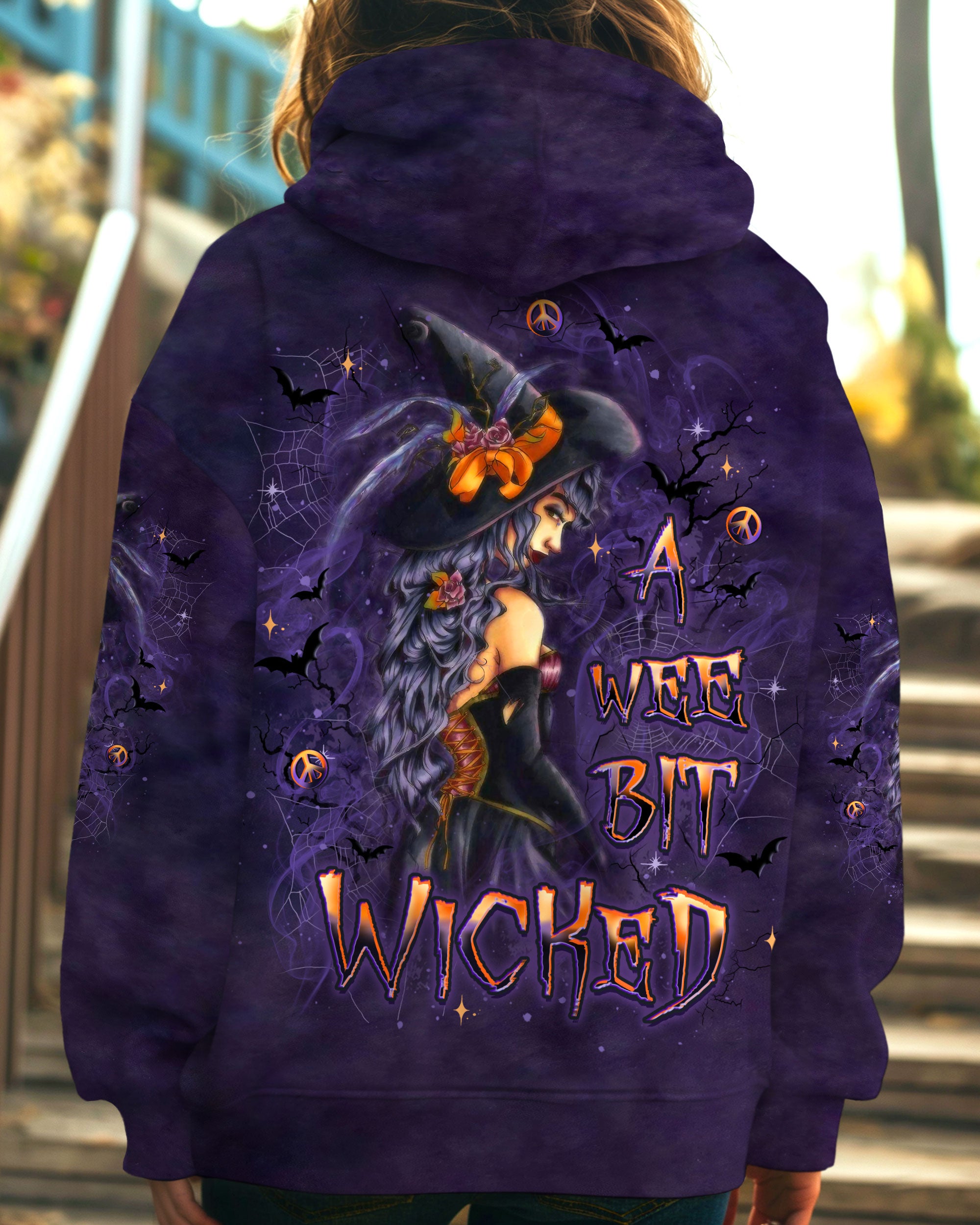 A Wee Bit Wicked Witch Shirt | All Over Print Detailed view of the witch illustration on the a wee bit wicked witch shirt, emphasizing artistic elements.