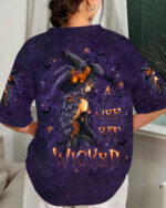 Front view of a wee bit wicked witch shirt in purple with striking witch design and Halloween motifs.