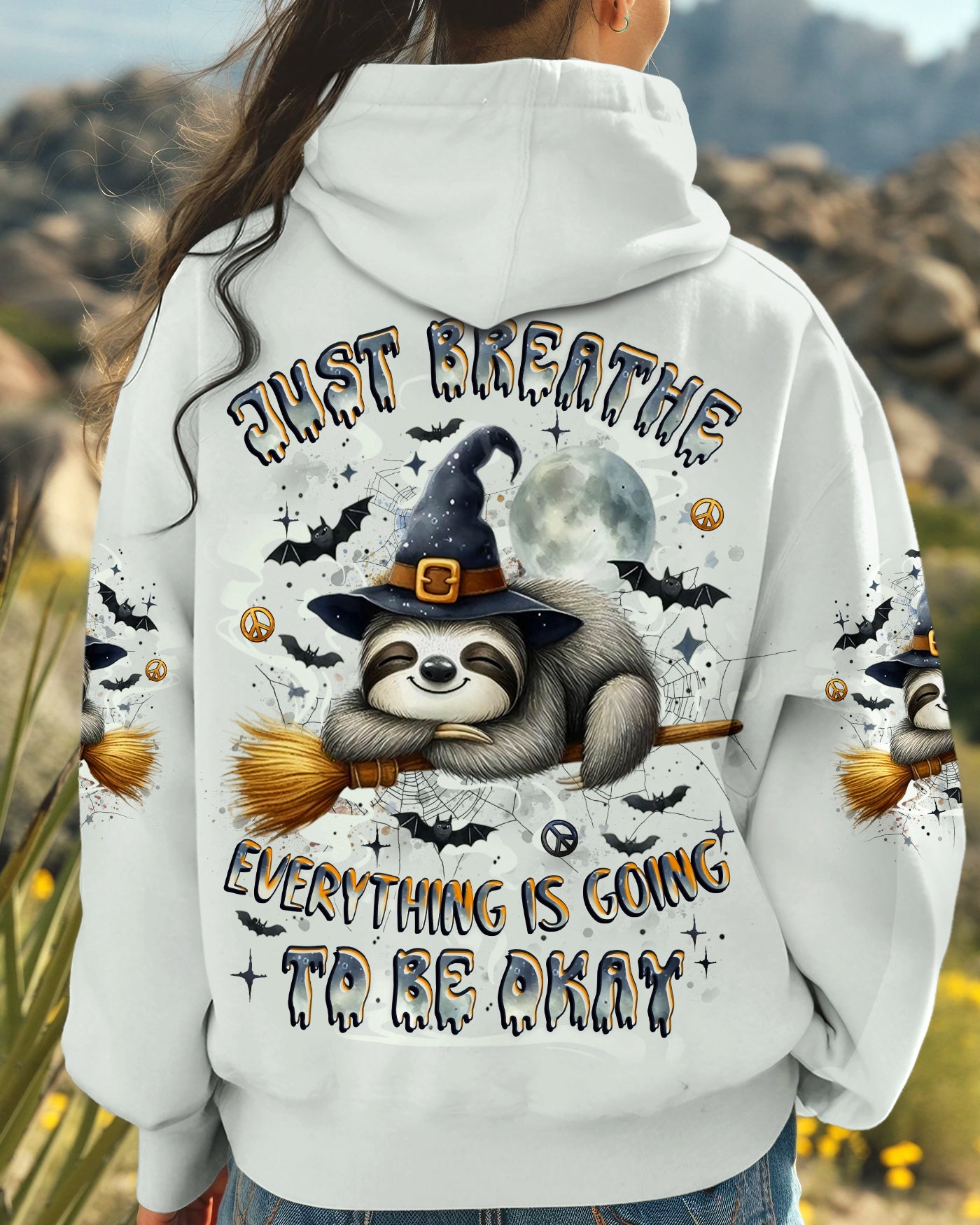 Just Breathe Sloth Witch Halloween Shirt Side angle of the just breathe sloth witch shirt, showing the unique design and comfortable fit on the wearer.