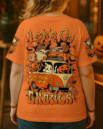 Back view of the Let's Go Ghouls Boo shirt in vibrant orange with fun Halloween graphics.