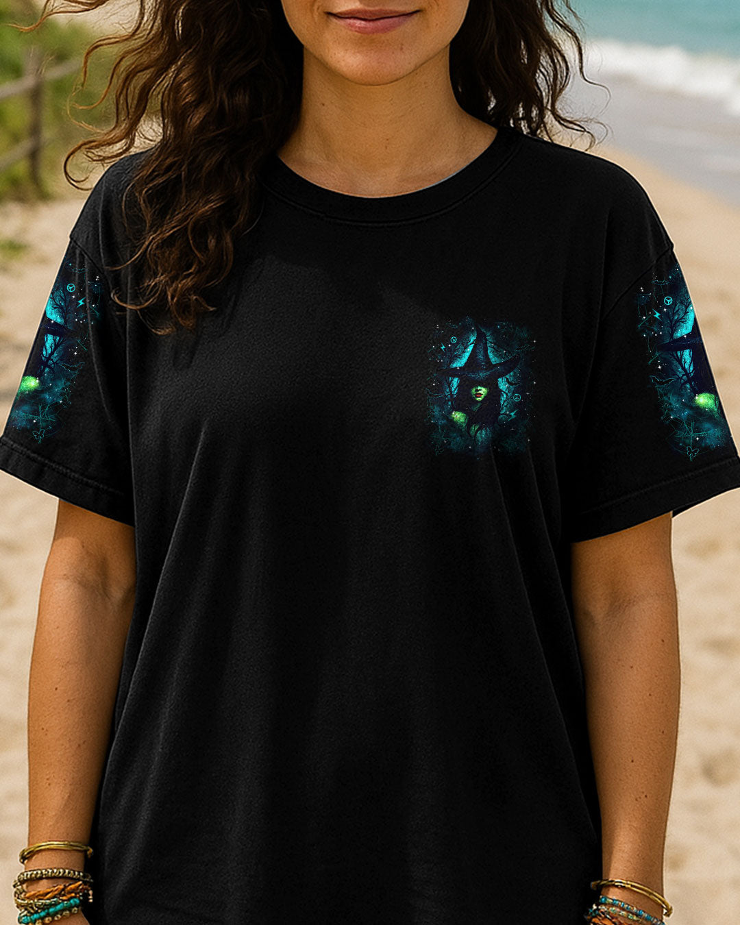 Back view showcasing the colorful witch graphic on 'A Wee Bit Wicked Halloween' black shirt.