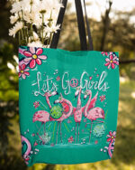 Front view of the let's go girls flamingo tote bag with vibrant teal color and playful flamingo design.