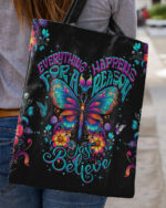 Front view of the just believe tote bag featuring a colorful butterfly design on a black background.