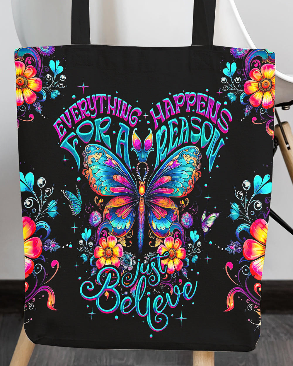 Just Believe Tote Bag | Motivational Floral Design Close-up of the just believe tote bag highlighting the intricate butterfly and text design in bright colors.