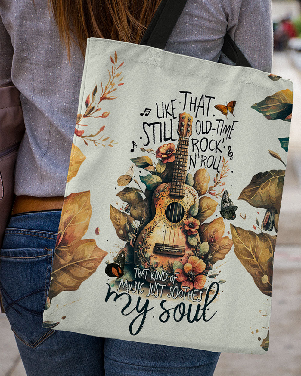 Music Just Soothes My Soul Tote Bag Front view of the music just soothes my soul tote bag featuring a guitar and floral design.